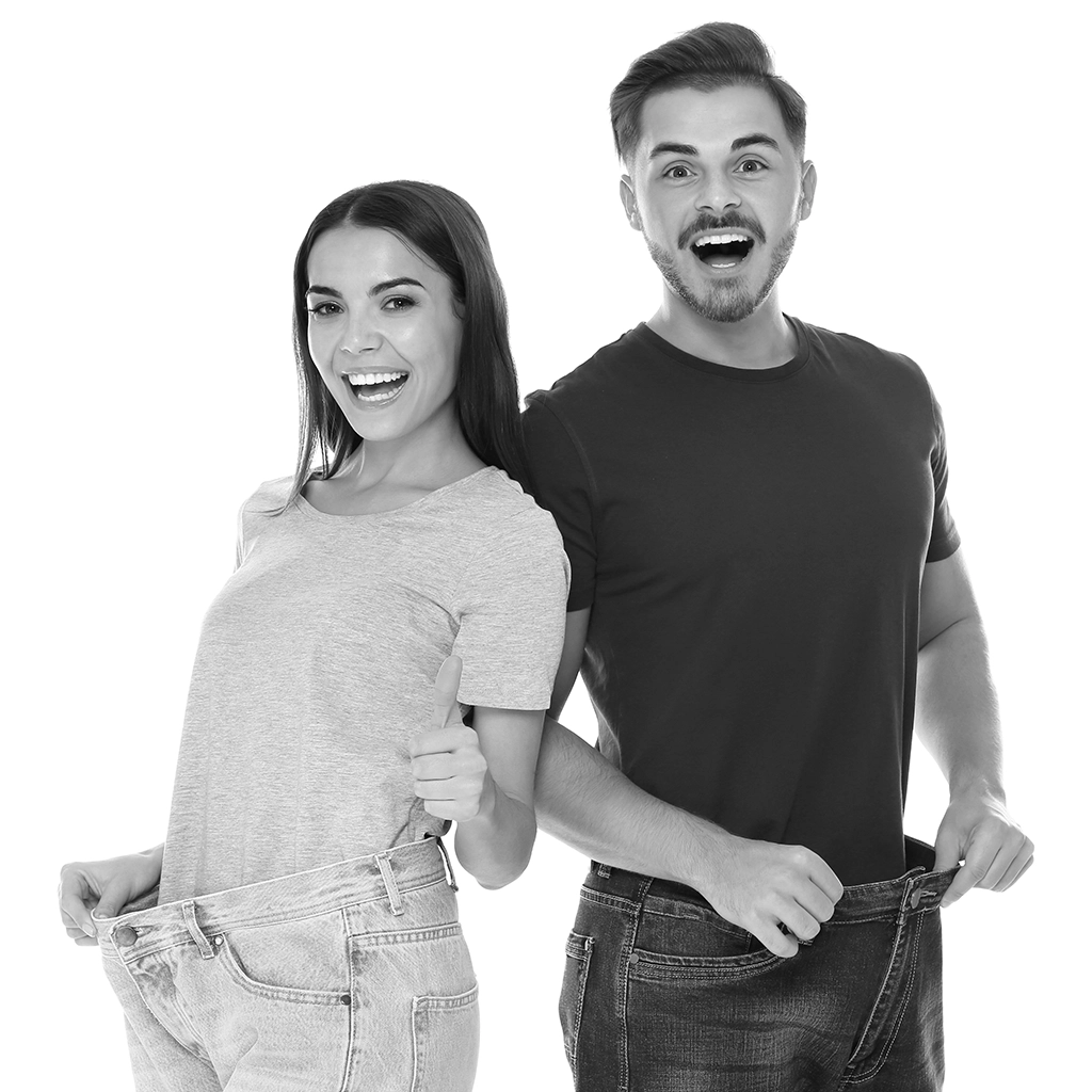 man and woman showing weight loss results with loose jeans